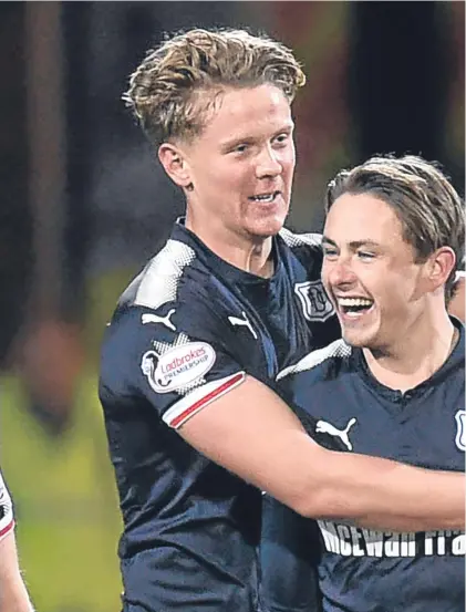  ??  ?? Mark O’Hara celebrates with Scott Allan, who threaded an exquisite pass for his winner against Rangers.