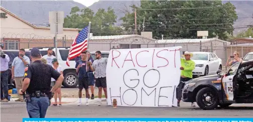  ?? — AFP ?? Protestors holding placards are seen as the motorcade carrying US President Donald Trump passes by on its way to El Paso Internatio­nal Airport on Aug 7, 2019, following his visit after last weekend’s mass shootings.