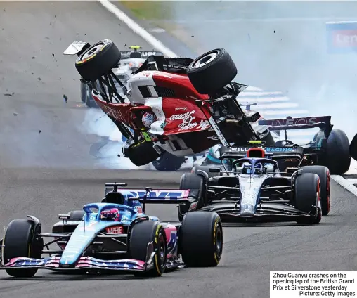 ?? ?? Zhou Guanyu crashes on the opening lap of the British Grand Prix at Silverston­e yesterday
Picture: Getty Images