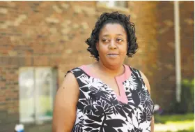  ?? Mark Lyons / New York Times ?? Tomika Waggoner, a nursing home aide whose wages vary on when she can work, stands outside her apartment in Newport, Ky.