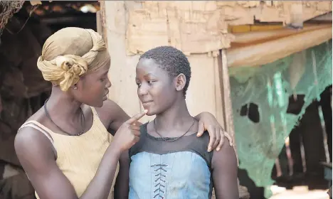  ??  ?? Lupita Nyong’o, left, plays the mother of Ugandan chess prodigy Phiona Mutesi, played by Madina Nalwanga, right, in Queen of Katwe.