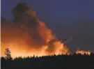  ?? Scott Stoddard / Associated Press ?? The Lava Fire near Weed, in Siskiyou County, burns Monday.