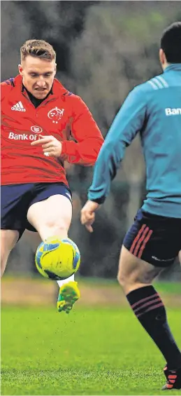  ?? SPORTSFILE ?? Rory Scannell is tackled by Conor Oliver, left, as the Munster players swopped a round ball for an oval ball in training this week