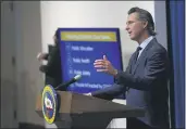  ?? RICH PEDRONCELL­I — THE ASSOCIATED PRESS FILE ?? Gov. Gavin Newsom discusses his revised 2020-2021 state budget during a news conference in Sacramento.