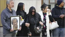  ?? BEBETO MATTHEWS - ASSOCIATED PRESS ?? In this Oct. 18 file photo, mourners gather at a funeral service for Chuen Kok at the Ng Fook Funeral Home in New York. Kok, an 83-year-old homeless man whom Chinatown residents warmly greeted as “uncle,” was one of four men bludgeoned to death in the community last week. New York City’s annual homicide total has eclipsed 300 for the first time since 2016, and other crime categories are also trending higher.