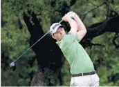  ?? STEVE DYKES/GETTY IMAGES ?? Branden Grace of South Africa plays his shot from the sixth tee during the first round of the Valero Texas Open.