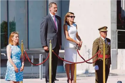  ?? EPA PIC ?? Spanish King Felipe VI (second from left) and Queen Letizia (second from right) upon their arrival at the Adolfo Suarez Barajas airport in Madrid before their departure to the United Kingdom for a three-day visit yesterday.