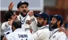  ??  ?? Virat Kohli celebrates with teammates after the wicket of England’s Jonny Bairstow at Lord’s. Photograph: Glyn Kirk/AFP/ Getty Images