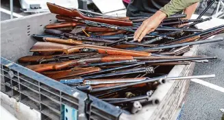  ?? Carlos Javier Sanchez/Contributo­r ?? Police store firearms turned in during the November gun buyback, which was a success because this community cares. Now Council Member John Courage wants to expand it.