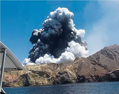  ?? — AFP ?? Aplumeofas­h rising into the air as the volcano on White Island erupts off the coast of Whakatane on New Zealand’s North Island last week.