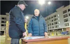  ?? RUSSIAN PRESIDENTI­AL PRESS OFFICE ?? In this photo taken from video Sunday, Russian President Vladimir Putin, right, listens to Russian Deputy Prime Minister Marat Khusnullin at a newly built neighbourh­ood during their visit to Mariupol in Russiancon­trolled Donetsk region, Ukraine.