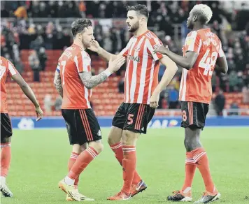  ??  ?? inst Newcastle Under-23s in a previous Checkatrad­e Trophy encounter at the Stadium of Light.