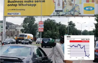  ?? | ?? People stand near an advertisin­g billboard for the / Reuters embattled MTN telecommun­ications company along a street in Abuja, Nigeria.