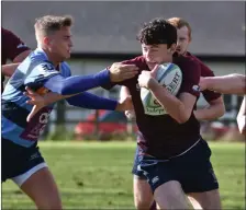  ?? ?? George Foster is tackled during Skins win over Dromore on Saturday at Mullaghmee­n.