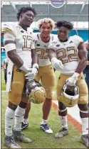  ?? AP-Wilfredo Lee ?? Georgia Tech’s Demetrius Knight II (from left), Sylvain Yondjouen and former Rome High standout Jamious Griffin celebrate after Saturday’s win at Miami.