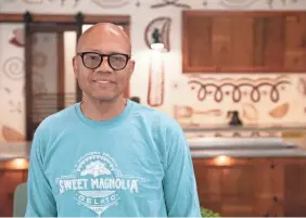  ?? ?? Hugh Balthrop, founder and creative director of Sweet Magnolia Gelato Co., stands at the new location in Crosstown Concourse. His original Memphis location was at Puck Food Hall, which shut down in late 2020.