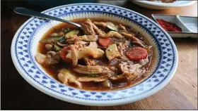  ?? GRETCHEN MCKAY — PITTSBURGH POST-GAZETTE/TNS ?? Seasoned with gochugaru, gochujang and soy sauce, this spicy chicken soup with handpulled noodles is packed with umami.