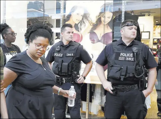  ?? Jeff Roberson The Associated Press ?? Missouri state Sen. Maria Chappelle-Nadal walks past police as she participat­es in a protest march Saturday through West County Mall in response to a not-guilty verdict in the trial of former St. Louis police officer Jason Stockley.