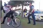  ?? Picture / Facebook ?? The video clip shows one officer pushing one of the teens off his bike on a footpath in Mangere.