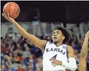  ?? File, Charlie Riedel / AP ?? Kansas guard Devonte’ Graham is a member of the Associated Press NCAA college basketball All-America first team, which was announced Tuesday.