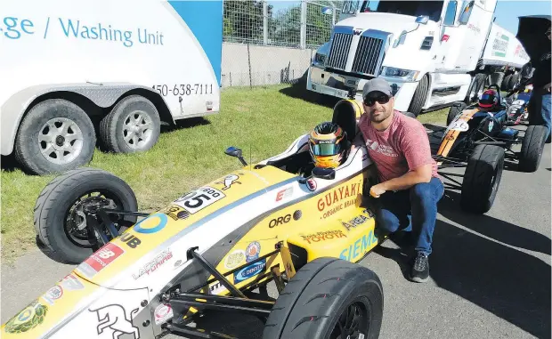  ?? PHOTOS: ANDREW MCCREDIE/DRIVING.CA ?? Marco Kacic with dad Danny awaits to roll out onto the Circuit Gilles Villeneuve for the second F1600 race during last weekend’s 2018 Canadian Grand Prix in Montreal.