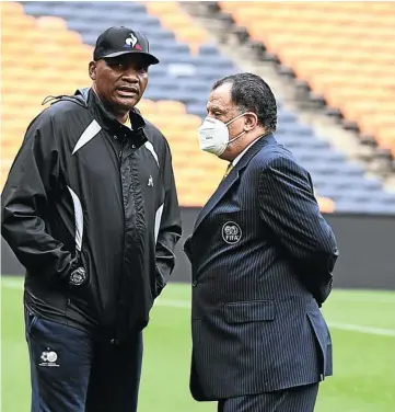  ?? Picture: Gallo Images ?? CENTRE OF THE STORM
Molefi Ntseki, sacked this week, with Safa president Danny Jordaan at a Bafana training session last month.