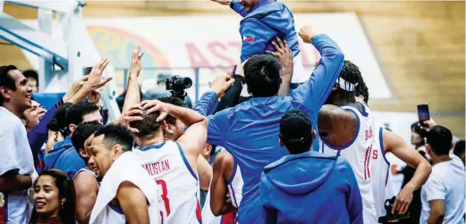  ??  ?? Gilas Pilipinas coach Yeng Guiao gets a victory ride after their 93-75 win over Kazakhstan late Sunday night in Astana during the qualifiers helped clinched for the Philippine­s a return trip to the 18th FIBA Basketball World Cup in China this September. (FIBA.com)