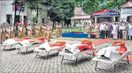  ??  ?? Assam CM Himanta Biswa Sarma pays homage to police personnel who died in Monday's clashes at Lailapur on the Assam-Mizoram border, in Silchar on Tuesday.