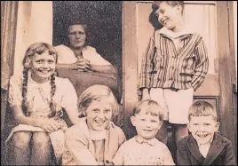  ?? SUBMITTED PHOTO ?? This is the only photo David Artiss has that includes Andreas Braun (standing). It was taken some time in 1939. The woman in the doorway is a Mrs. James (neighbour originally from Germany), the girl at far left is her daughter (name unknown). Sitting in front, from left, are Christine Artiss (David’s sister), an unknown boy and David Artiss.