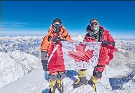  ?? THE CANADIAN PRESS/HO-RED DEER ADVOCATE-JOHN OLDRING ?? John Oldring, left, and guide Willie Benega posed at the top of Mount Everest May 25. Oldring, a former Alberta politician, was on the slopes of Everest last year when a deadly earthquake struck and vowed to return and reach the top.