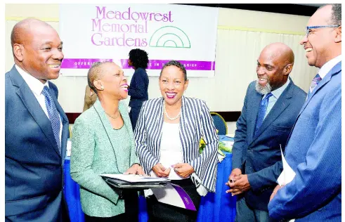  ?? IAN ALLEN/PHOTOGRAPH­ER ?? (From left) The Reverend Norbert Stephens, general secretary of the United Church in Jamaica and the Cayman Islands; master of ceremonies Shirley Daley; Ingrid Chambers, CEO, United Church Mission Enterprise; Claude Hamilton, councillor, St Catherine Municipal Corporatio­n; and Stefan Wright, chairman, Funeral Services Committee, share a joke during the annual appreciati­on and celebratio­n of funeral directors and awards luncheon at The Jamaica Pegasus hotel in New Kingston yesterday.