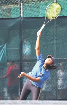  ?? — Photos courtesy of Dr Wee Thian Yew ?? Adani plays a shot during the first singles match against Chiang Yen Ni of Chinese Taipei.