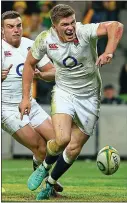  ??  ?? DECISIVE: Owen Farrell celebrates scoring England’s second try