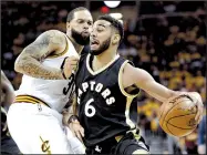  ?? AP/TONY DEJAK ?? Toronto guard Cory Joseph (right) and the rest of the Raptors find themselves in a two-game hole after losing Wednesday’s game at Cleveland, but the series shifts to Canada for Game 3 on Friday.