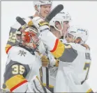  ?? Josie Lepe The Associated Press ?? Goaltender
Oscar Dansk, left, is mobbed by teammates after Max Pacioretty scores in overtime to give the Golden Knights a 5-4 victory over the San Jose Sharks on Friday night.