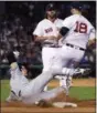  ?? CHARLES KRUPA — THE ASSOCIATED PRESS ?? The Indians’ Bradley Zimmer, left, slides as he is forced out by Red Sox first baseman Mitch Moreland.
