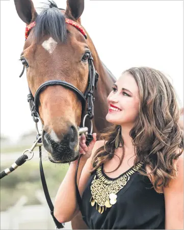  ?? Picture: Liesl King ?? GOOD TO GO. Asta Kraus with Black Arthur ahead of today’s Vodacom Durban July at Greyville Racecourse. Black Arthur, ridden by jockey Grant van Niekerk, has four wins.