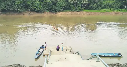  ??  ?? People from upper Baram river going to Long Lama to trade and get supplies dock their boats at the pier of Baram River.