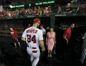  ?? MANUEL BALCE — THE ASSOCIATED PRESS ?? Washington Nationals outfielder Bryce Harper (34) leaves the field as the team ended its last home game of the season with a 9-3 rain-delayed win against the Miami Marlins in Washington. As much as the Nationals already have done to try to improve a team that flopped in 2018, one question will hover over their offseason until it’s resolved: What is going to happen with Harper?