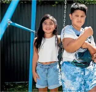  ?? TOM LEE/STUFF ?? Fatupaito Timson, 9, centre, says he’s excited to get the vaccine. He, cousin Maia Davis, 6, left, and sister Dylan Timson, 11, will be getting theirs when it becomes available to kids today.