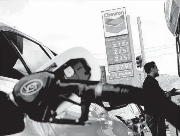  ?? Christina House Los Angeles Times ?? MOTORISTS fill up at a station in Burbank. A GOP political consultant said “the Democrats handed us a gift” by passing increased fuel taxes and new vehicle fees to raise $5.2 billion annually for road and bridge repairs.