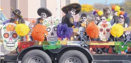  ?? GREG SORBER/JOURNAL ?? The Reginald Chavez Elementary School float was festooned with skulls for the Día de Los Muertos Marigold Parade on Sunday in the South Valley.