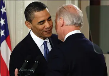  ?? J. SCOTT APPLEWHITE — THE ASSOCIATED PRESS FILE ?? Vice President Joe Biden whispers “This is a big f——— deal,” to President Barack Obama after introducin­g Obama during the health care bill ceremony in the East Room of the White House in Washington, March 23, 2010. President Joe Biden will share a stage with Barack Obama and Bill Clinton in New York as he raises money for his reelection campaign. Thursday’s event is a one-of-a-kind political extravagan­za that will showcase decades of Democratic leadership.