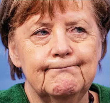  ??  ?? Row: Mrs Merkel in Berlin yesterday. She said the EU ‘has a problem with AstraZenec­a’