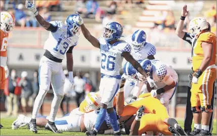  ?? Jacob Noger / Collegiate Images via Getty Images ?? Brandin Echols (26) of Kentucky celebrates a turnover against Tennessee on Saturday. The Wildcats had three intercepti­ons against the Volunteers, two of which were returned for touchdowns.