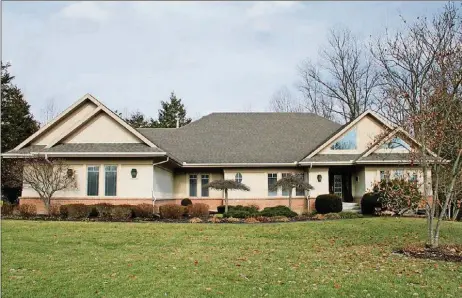  ?? CONTRIBUTE­D PHOTOS BY KATHY TYLER ?? The brick ranch has about 4,760 sq. ft. of living space that includes a fully finished, walk-out lower level.