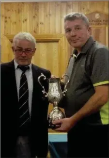  ??  ?? MacBride Pitch & Putt Clubmember Sean Goggin receiving the Glenville Scratch Cup following his superb win on Sunday.