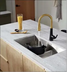  ?? KOHLER VIA AP ?? This image released by Kohler shows Kohler’s Tone faucet which allows for voice control of on/off, amounts and preset measuremen­ts. The product’s Kohler Konnect app pairs with Alexa, Google Home and Apple Home Kit.