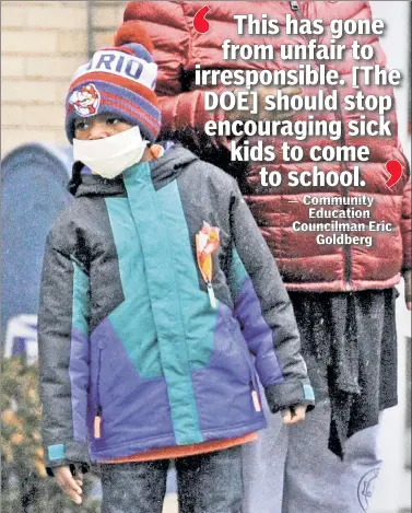  ??  ?? BODES ILL: This boy stays safe with a mask. Meanwhile, others go to school sick amid a deadly flu season.