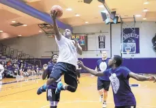  ?? DAVID GARRETT / SPECIAL TO THE MORNING CALL ?? Jamil Newsome, an Allentown patrolman who played at Rider, is a new member of the Dieruff coaching staff. Here he's driving to the basket in the school's recent Unity Game on Linda Cruttenden Court at Dick Schmidt Gymnasium.